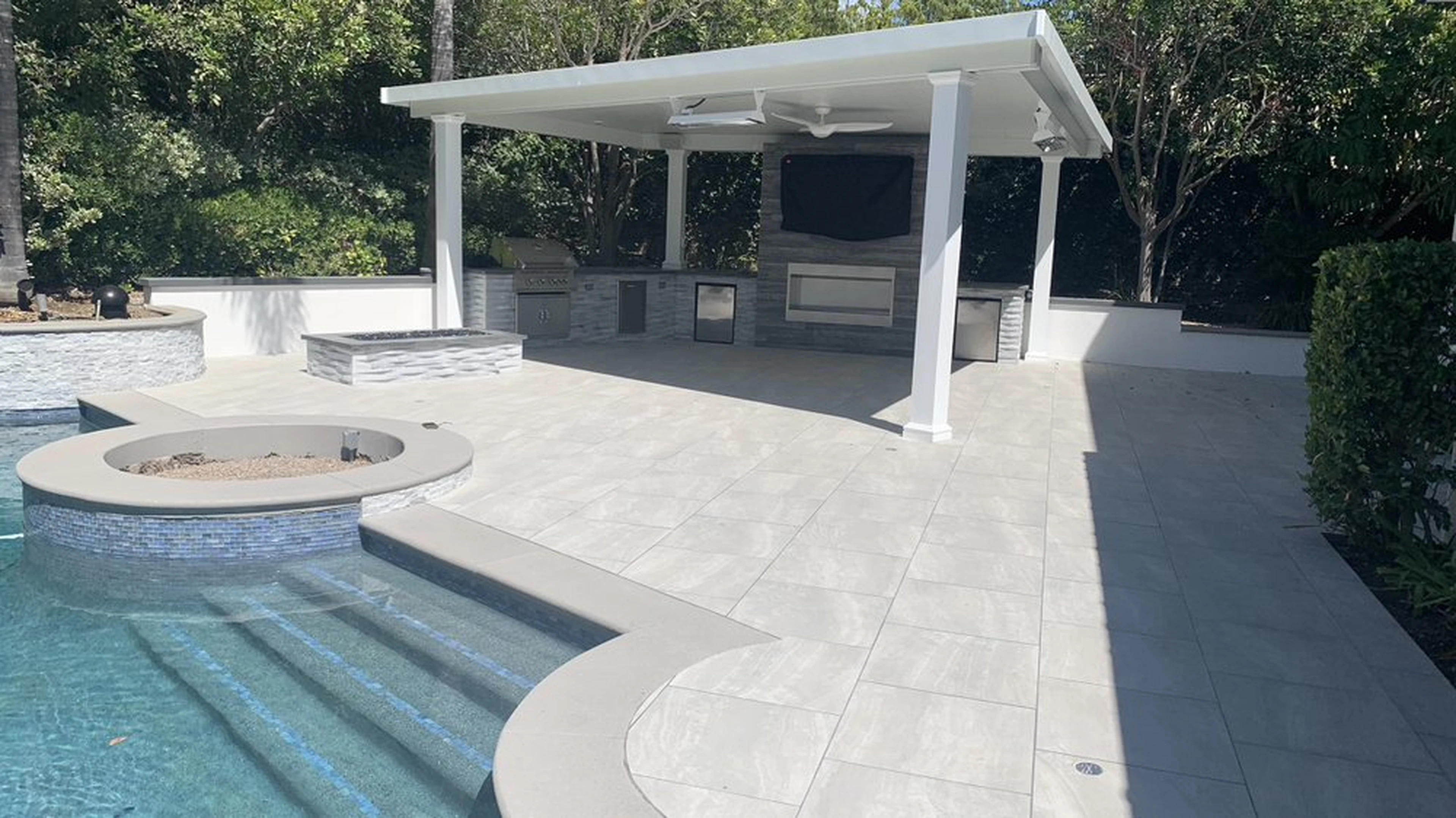 Completed Dove Canyon pool and patio remodel with large-format paving, spa, and covered outdoor living area